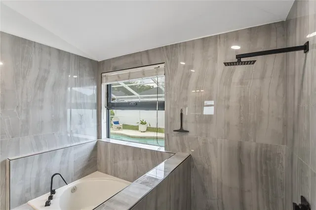 a bathroom with a sink and a shower