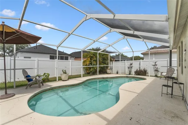 an outdoor space with patio furniture and white umbrellas