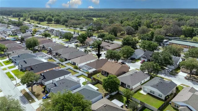 an aerial view of residential house with outdoor space