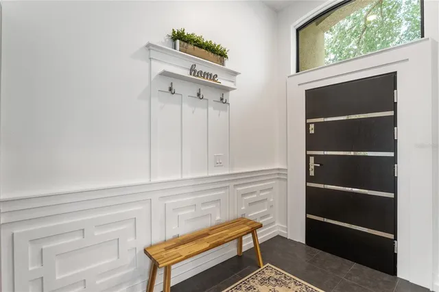 a view of a livingroom with furniture and a window