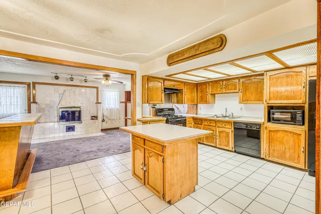 a view of a room with a chandelier fan and closet
