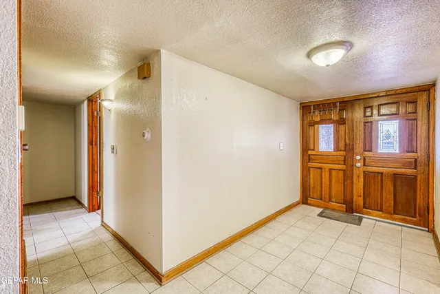 a view of a kitchen with a large window