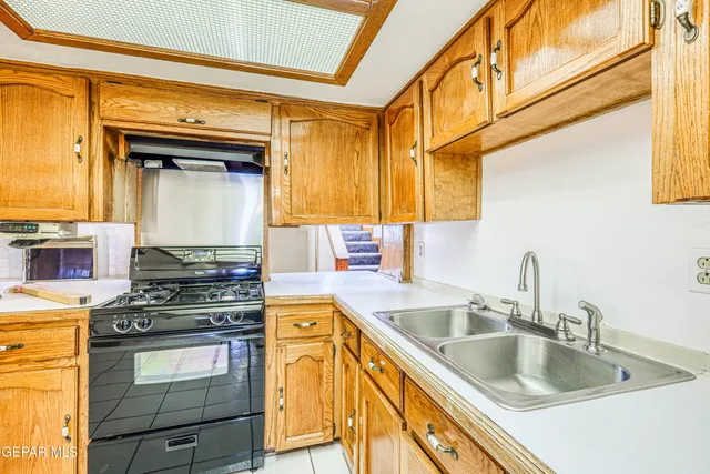 an aerial view of a house with a garden and plants