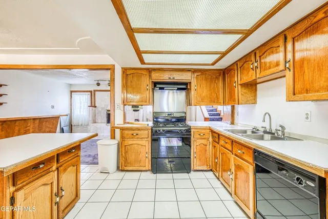 an aerial view of residential houses with outdoor space and parking