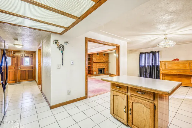 a view of house with backyard and trees