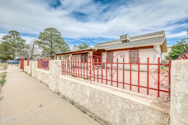 a view of a bedroom with a ceiling fan and bathroom