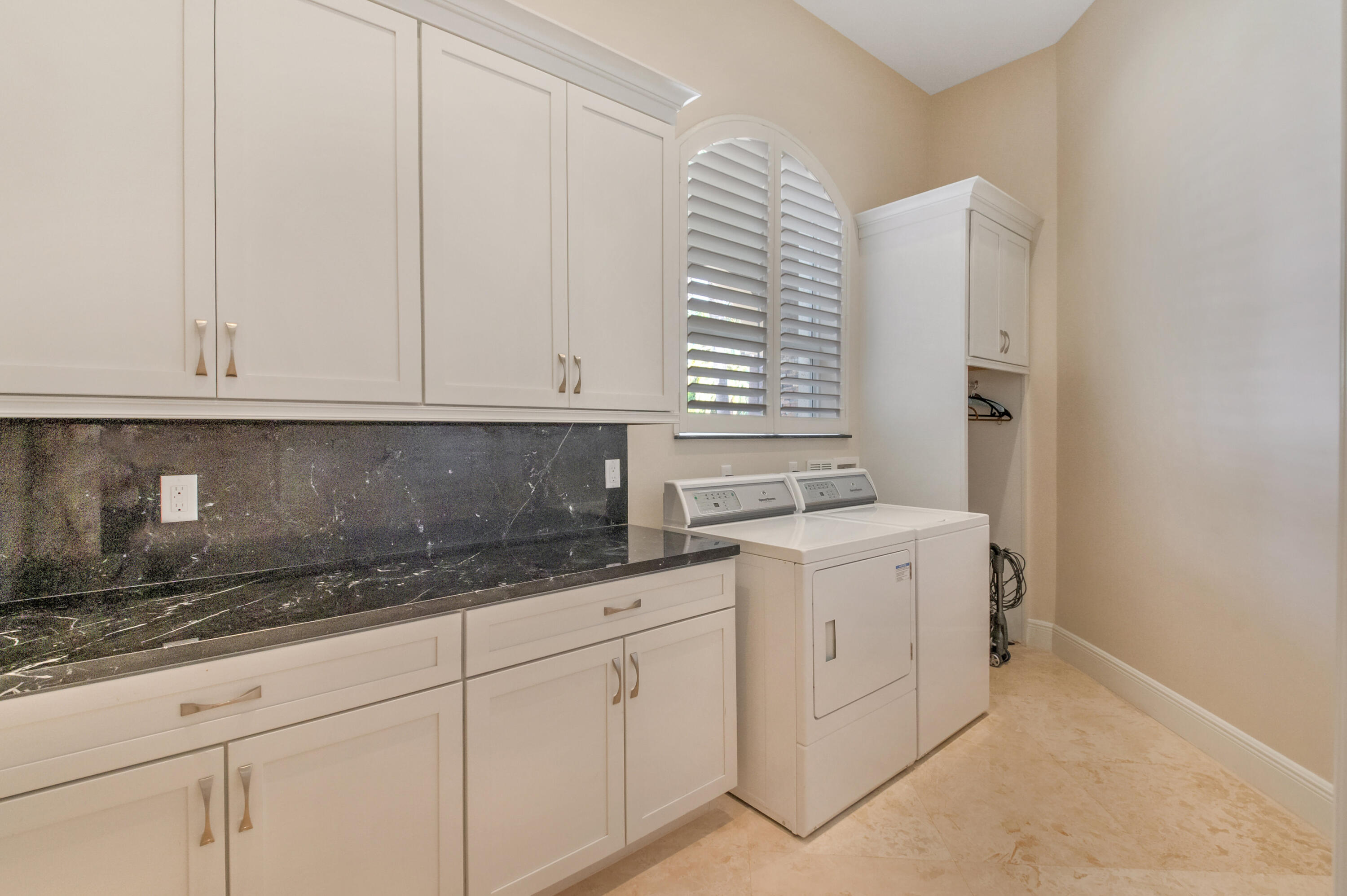 1130 Spanish River Road Boca Raton, FL 33432 - Photo 11 of 59 a kitchen with stainless steel appliances granite countertop white cabinets and a sink