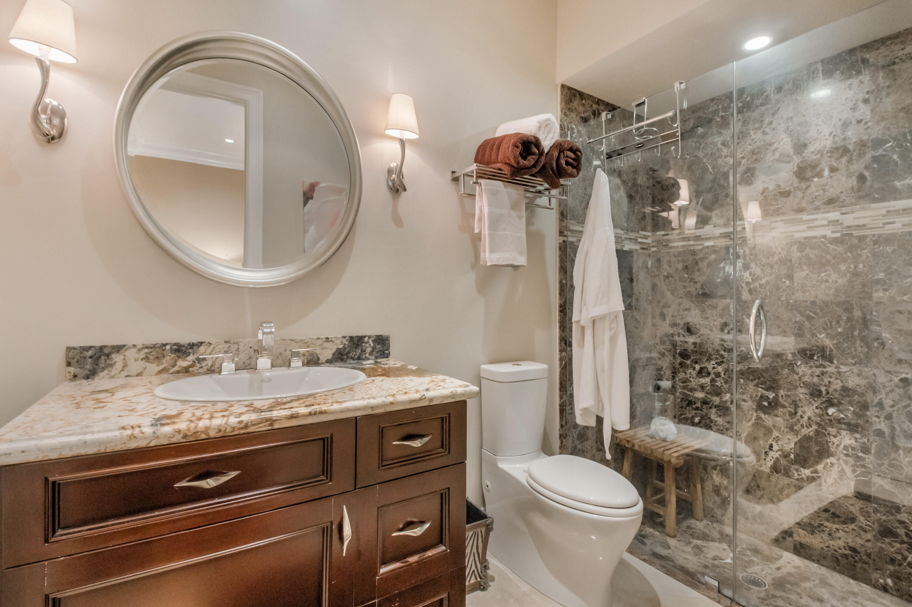 1130 Spanish River Road Boca Raton, FL 33432 - Photo 15 of 59 a bathroom with a granite countertop toilet sink and mirror