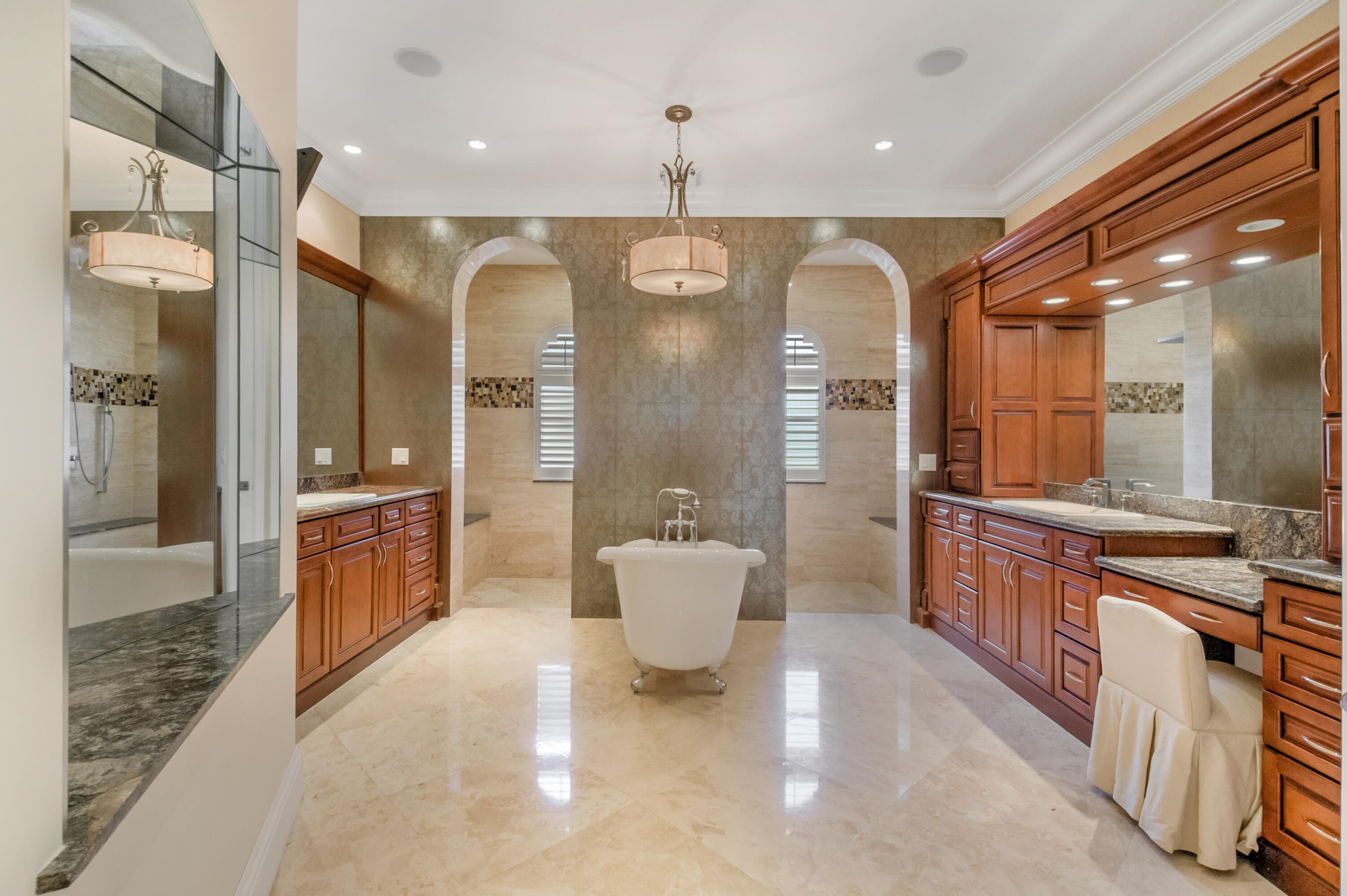 1130 Spanish River Road Boca Raton, FL 33432 - Photo 19 of 59 a bathroom with a double vanity sink and mirror