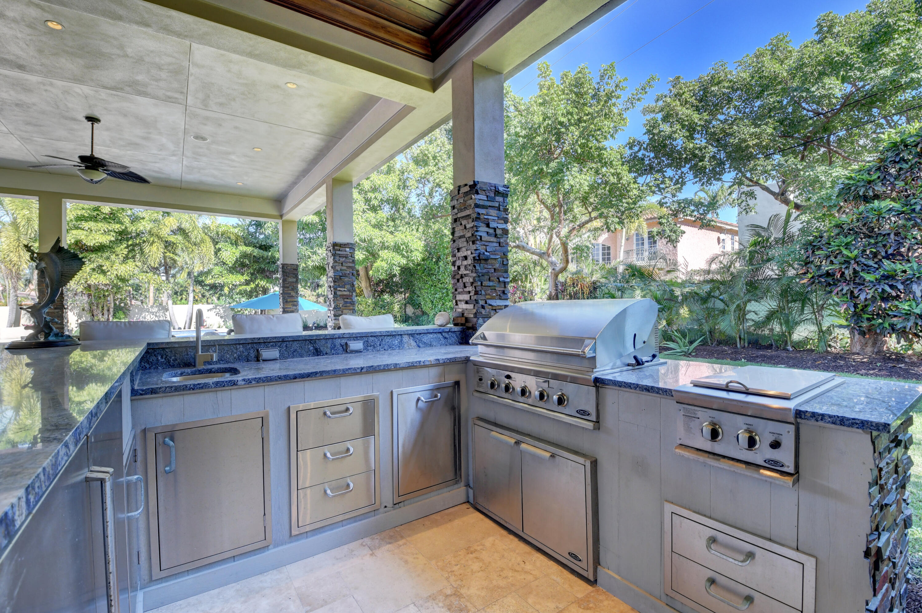1130 Spanish River Road Boca Raton, FL 33432 - Photo 28 of 59 a kitchen with a stove and cabinets