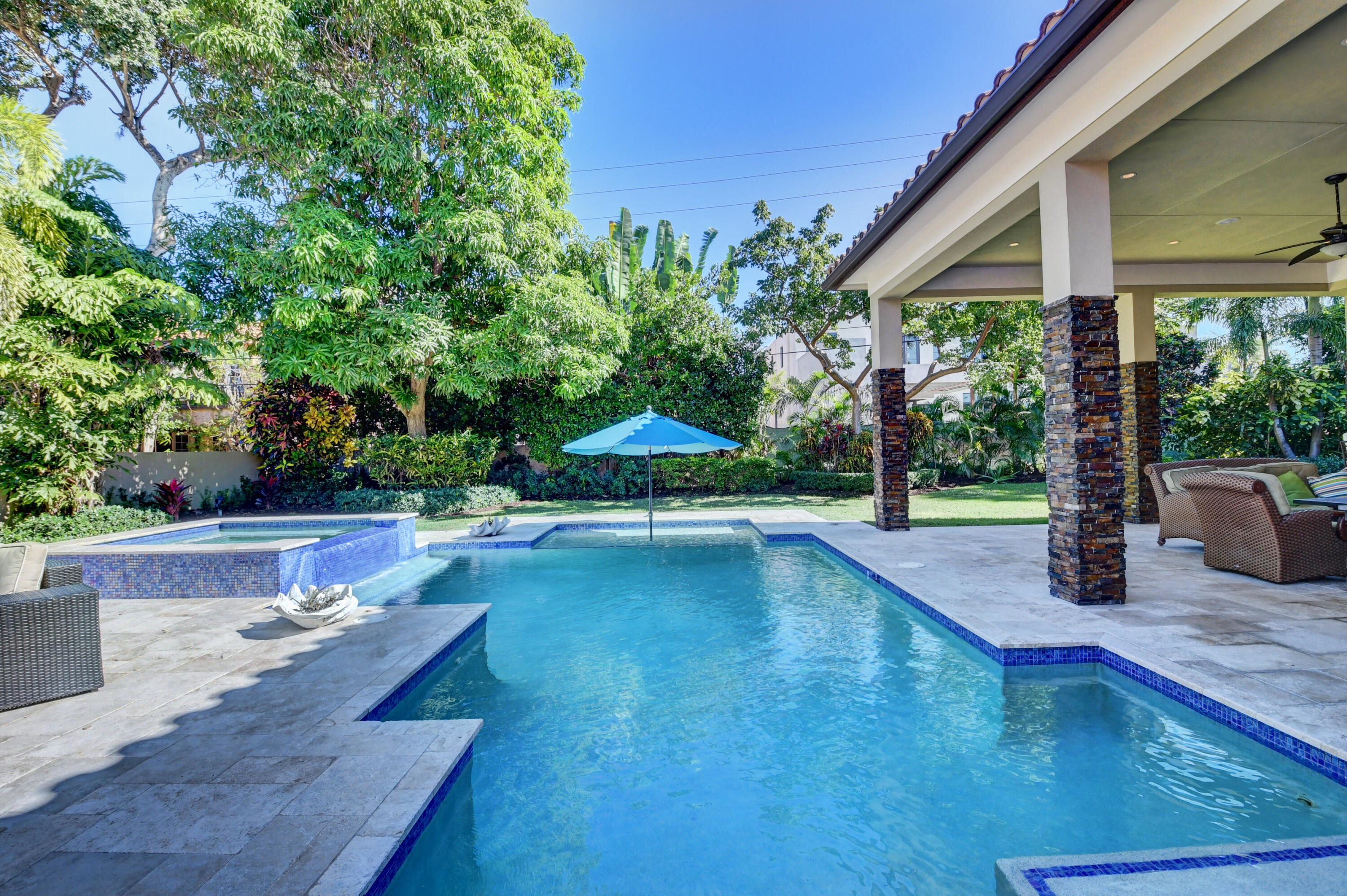 1130 Spanish River Road Boca Raton, FL 33432 - Photo 34 of 59 a view of a swimming pool with a patio