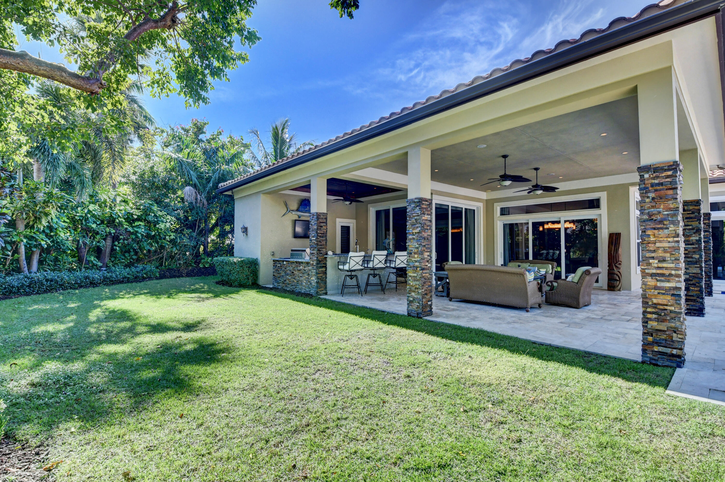 1130 Spanish River Road Boca Raton, FL 33432 - Photo 39 of 59 a view of a house with backyard porch and sitting area
