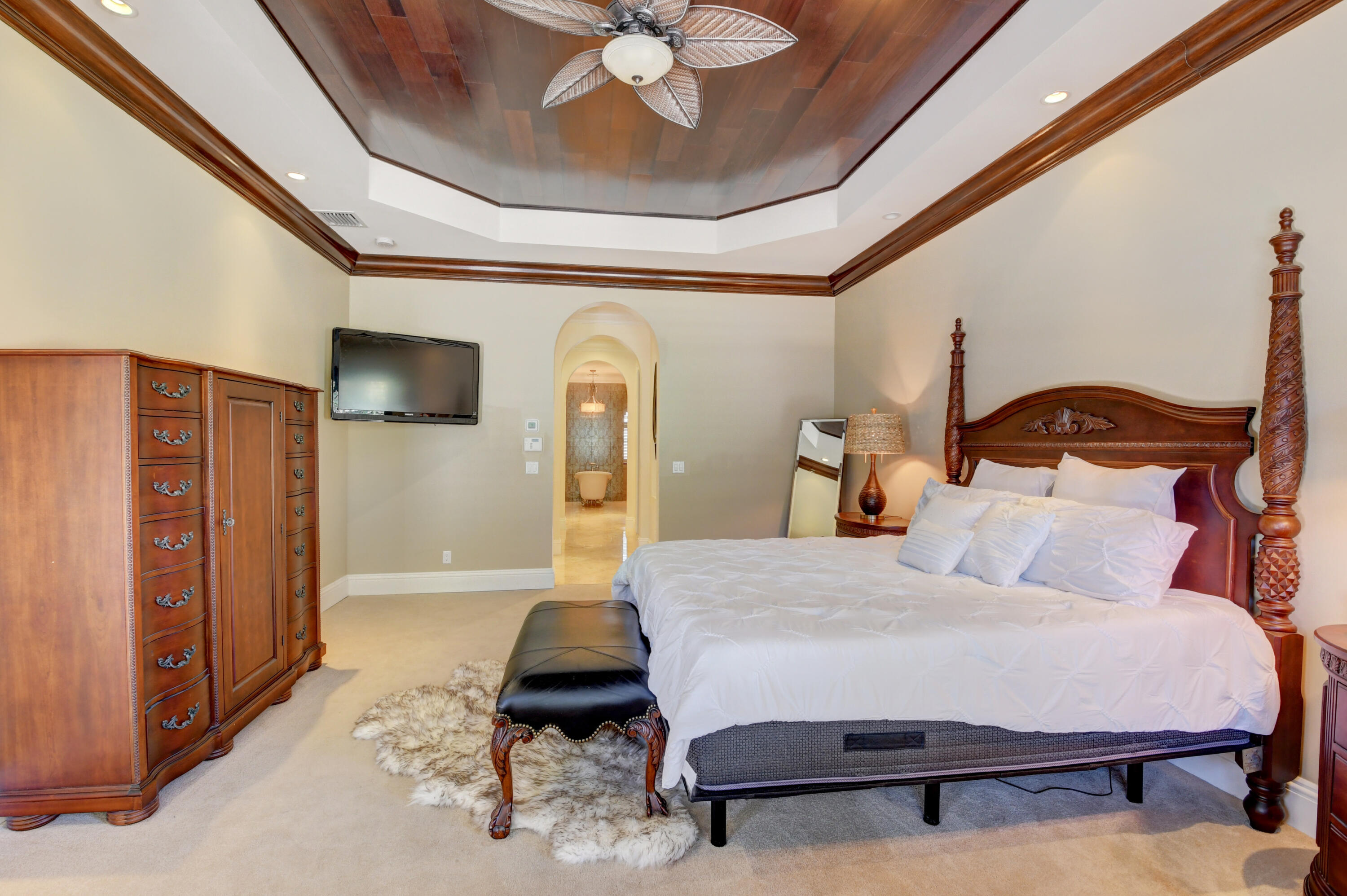 1130 Spanish River Road Boca Raton, FL 33432 - Photo 44 of 59 a bedroom with a bed a dresser and flowerpot