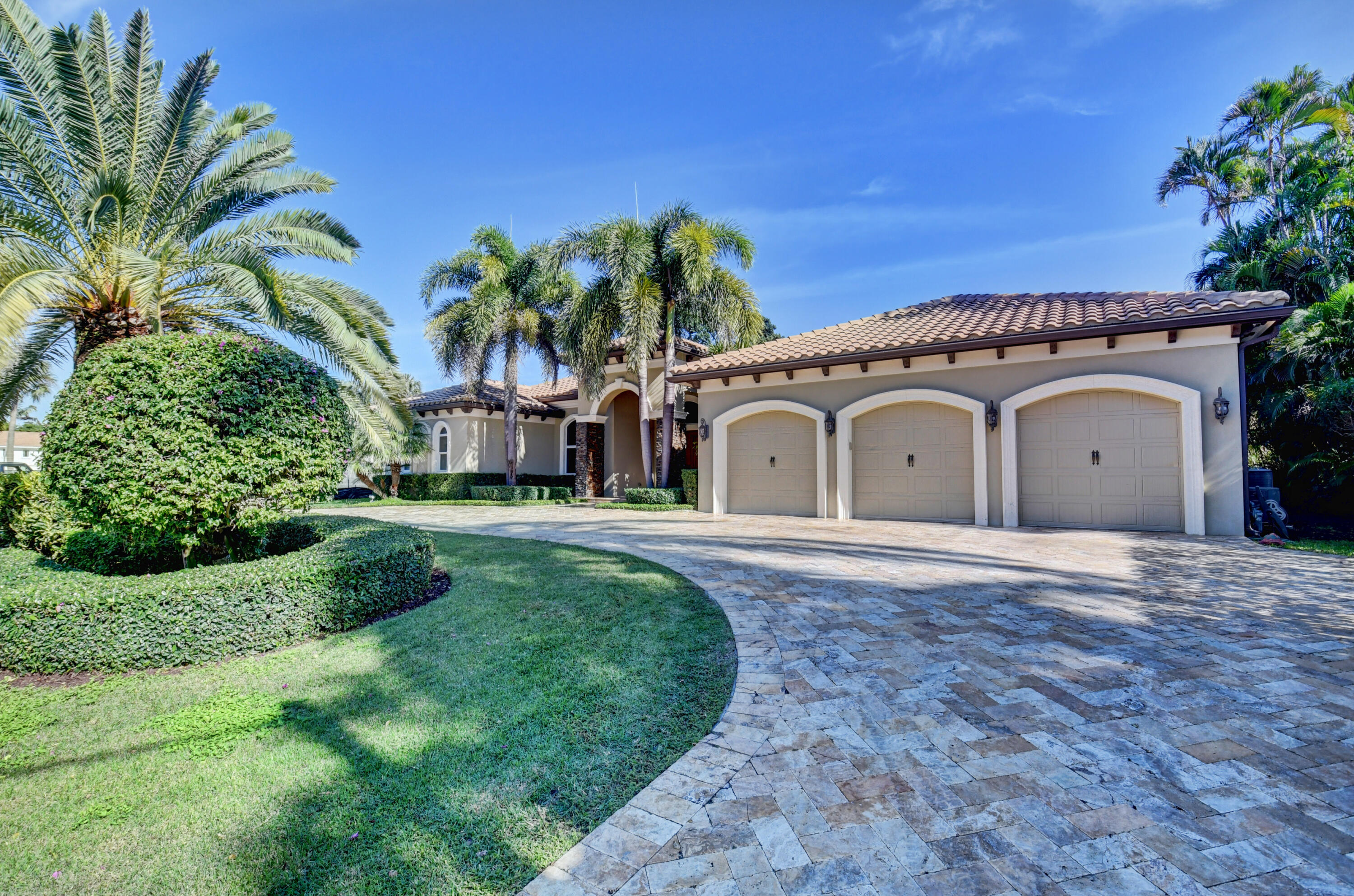 1130 Spanish River Road Boca Raton, FL 33432 - Photo 53 of 59 a view of a house with a swimming pool and a yard