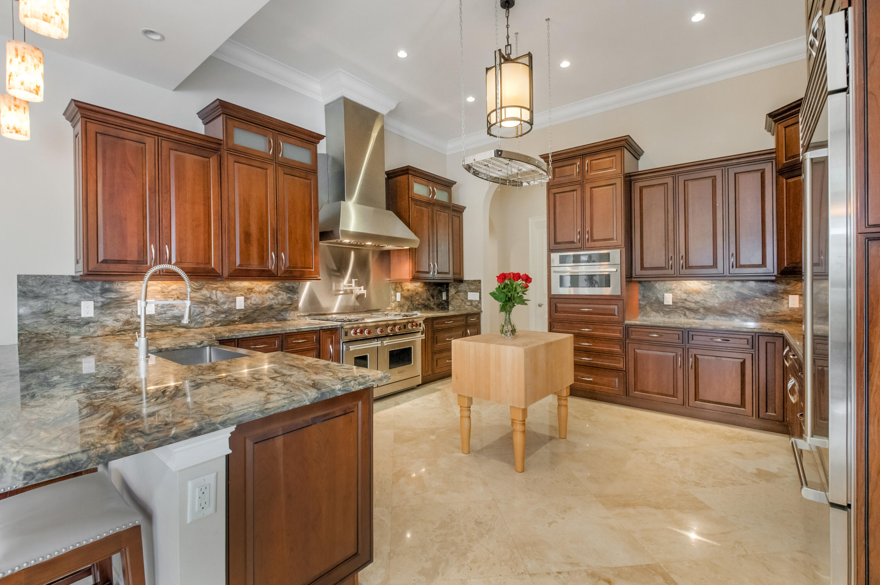 1130 Spanish River Road Boca Raton, FL 33432 - Photo 7 of 59 a kitchen with stainless steel appliances granite countertop a sink stove and refrigerator