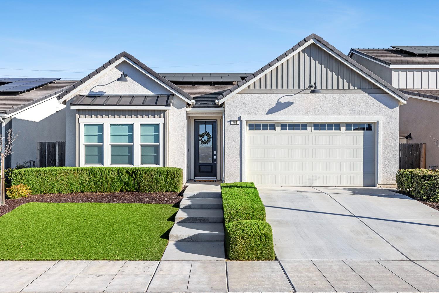 a front view of a house with a yard