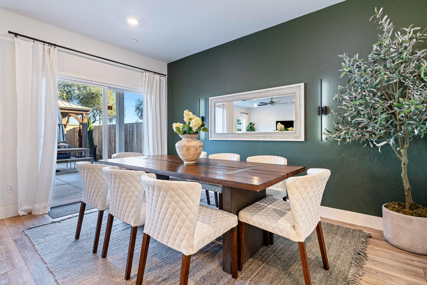 601 Wishon Avenue Madera, CA 93636 - Photo 14 of 33 a view of a dining room with furniture window and wooden floor