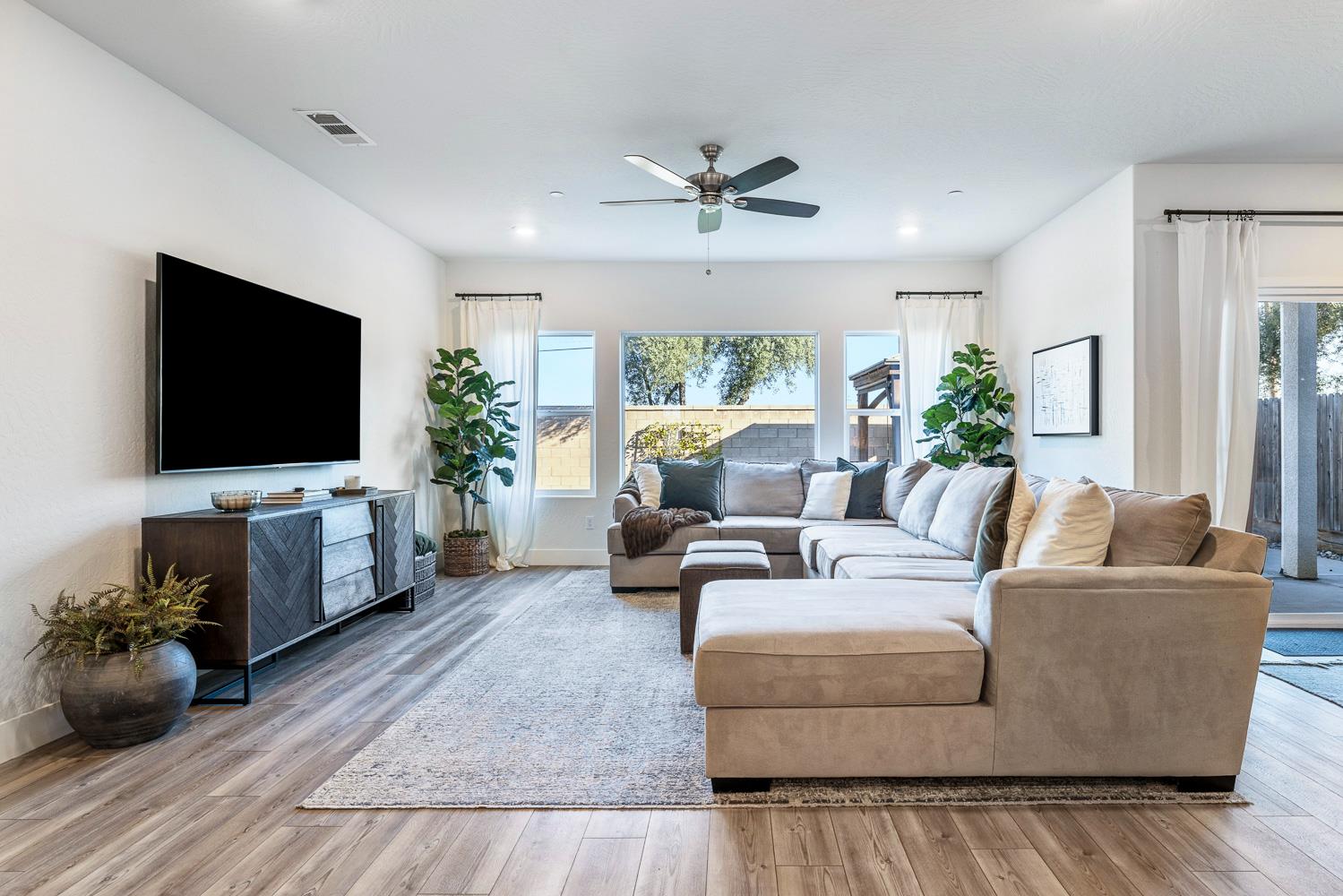 601 Wishon Avenue Madera, CA 93636 - Photo 16 of 33 a living room with furniture and a flat screen tv