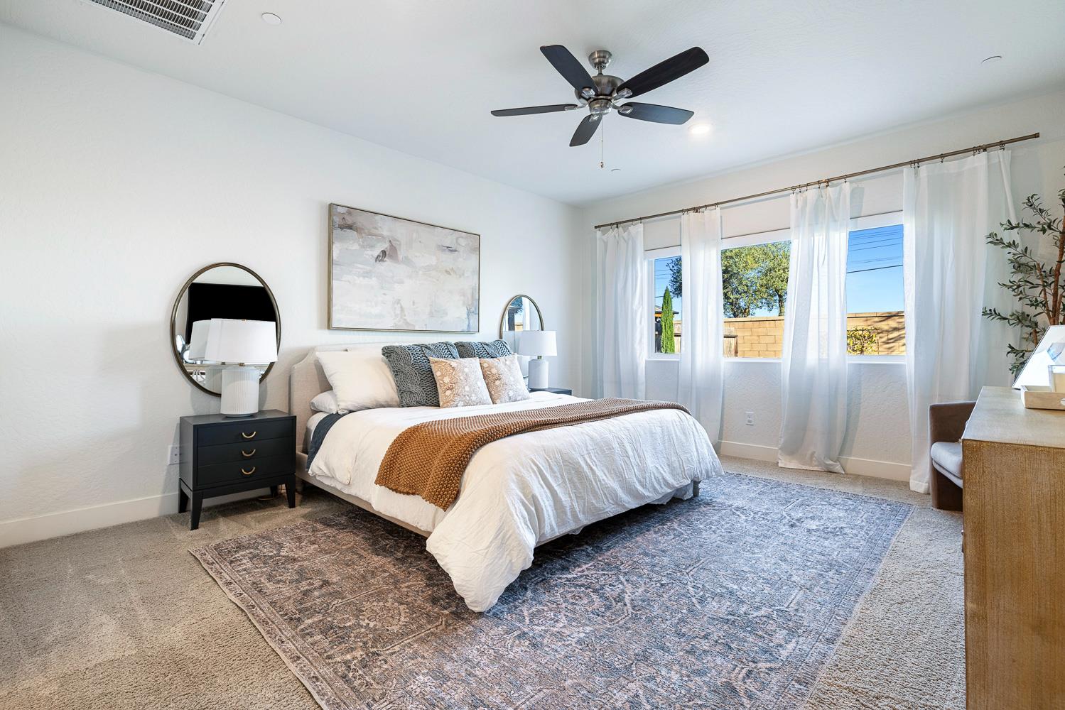 601 Wishon Avenue Madera, CA 93636 - Photo 18 of 33 a bedroom with a large bed and a window