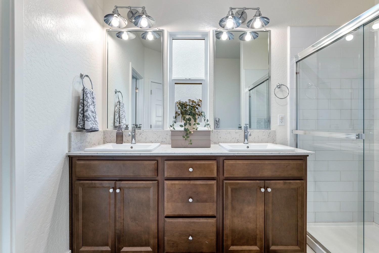 601 Wishon Avenue Madera, CA 93636 - Photo 22 of 33 a bathroom with a double vanity sink and mirror