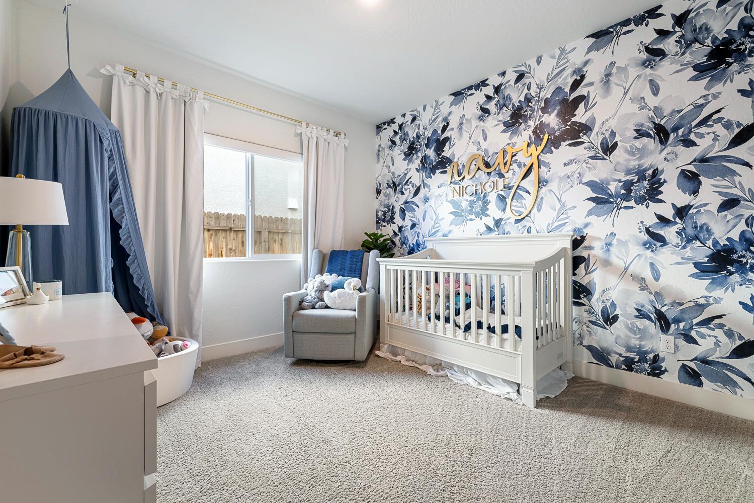 601 Wishon Avenue Madera, CA 93636 - Photo 27 of 33 a bedroom with a bed and a window