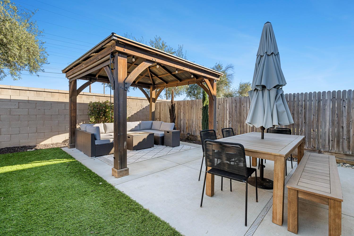 601 Wishon Avenue Madera, CA 93636 - Photo 32 of 33 a view of a chairs and table in the backyard