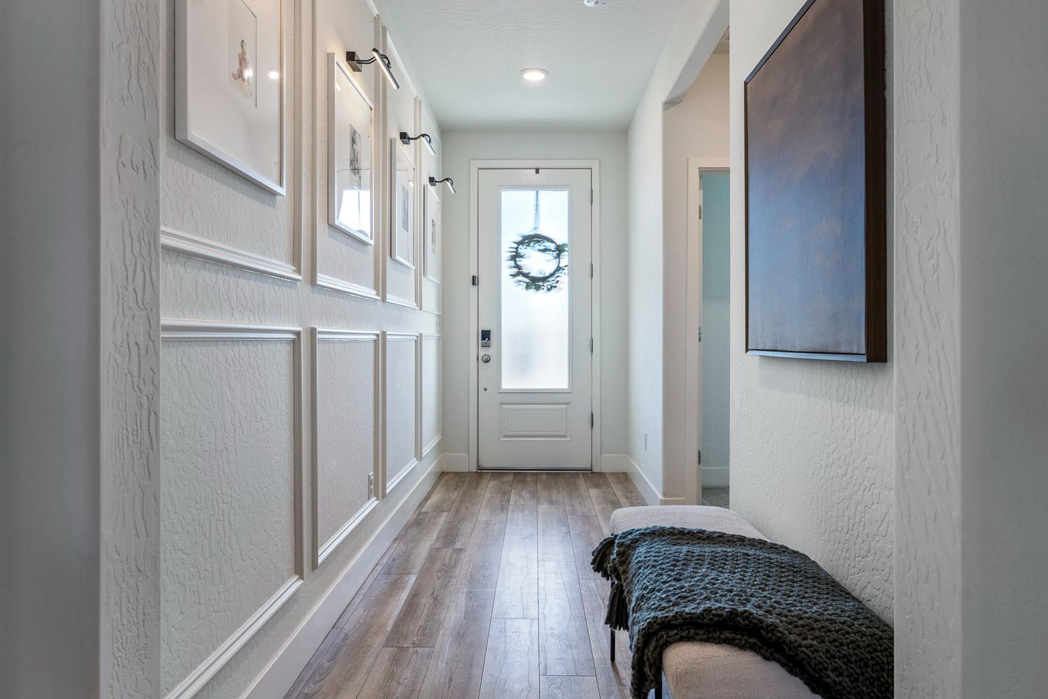 601 Wishon Avenue Madera, CA 93636 - Photo 5 of 33 a view of hallway with walk in closet and wooden floor