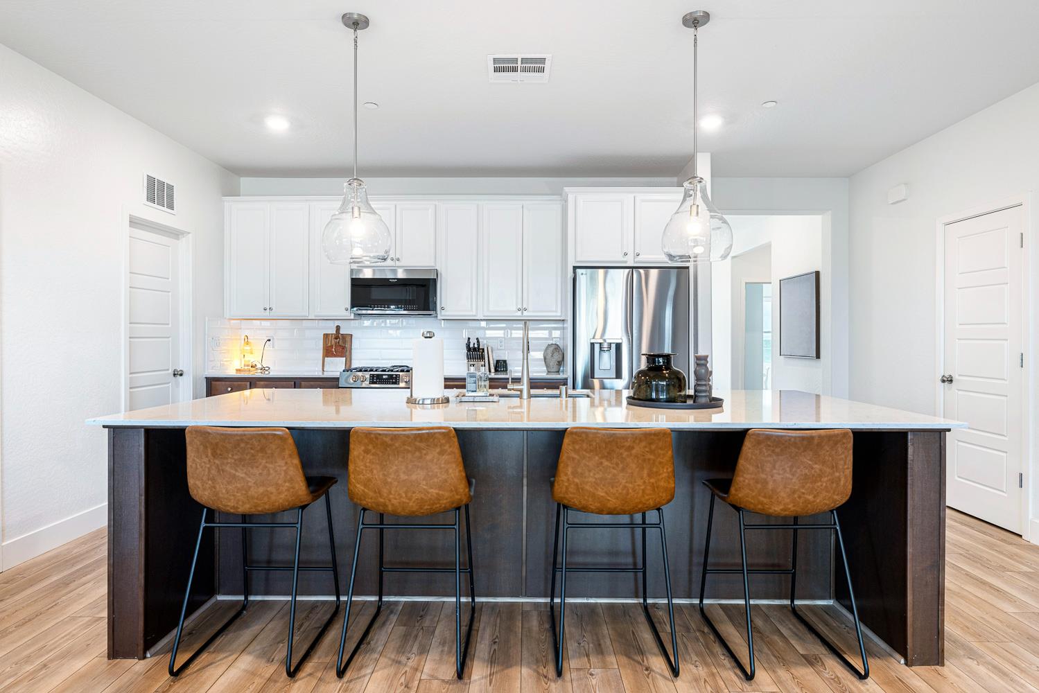 601 Wishon Avenue Madera, CA 93636 - Photo 9 of 33 a kitchen with cabinets and chairs