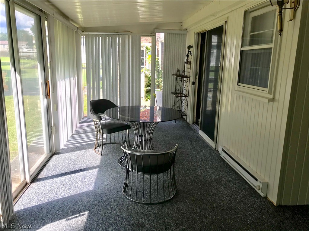 1306 South Meridian Road Youngstown, OH 44511 - Photo 17 of 31 352 SQUARE FEET OF TOTAL RELAXATION ON THE 4-SEASON SUN ROOM W/ CARPETING, SLIDING GLASS DOOR OFF OF THE KITCHEN