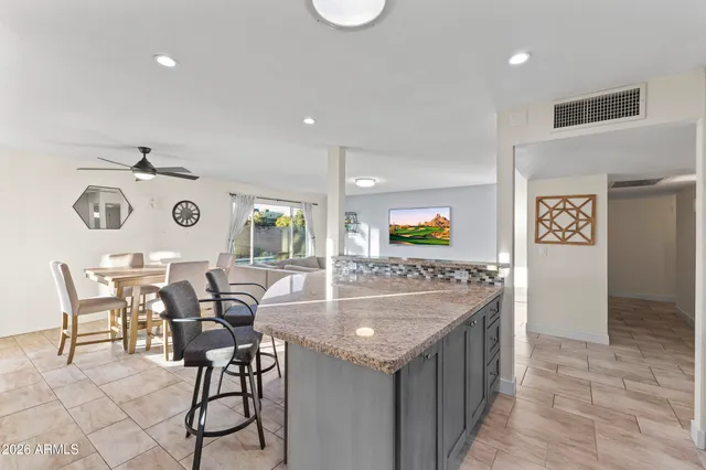 a bedroom with a bed and dresser