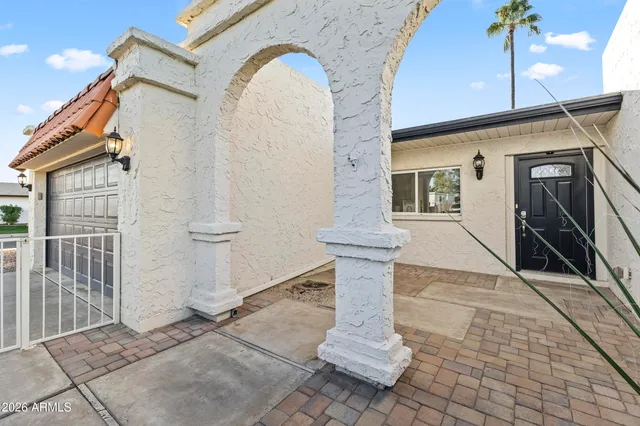 a view of a potted plants in front of a house