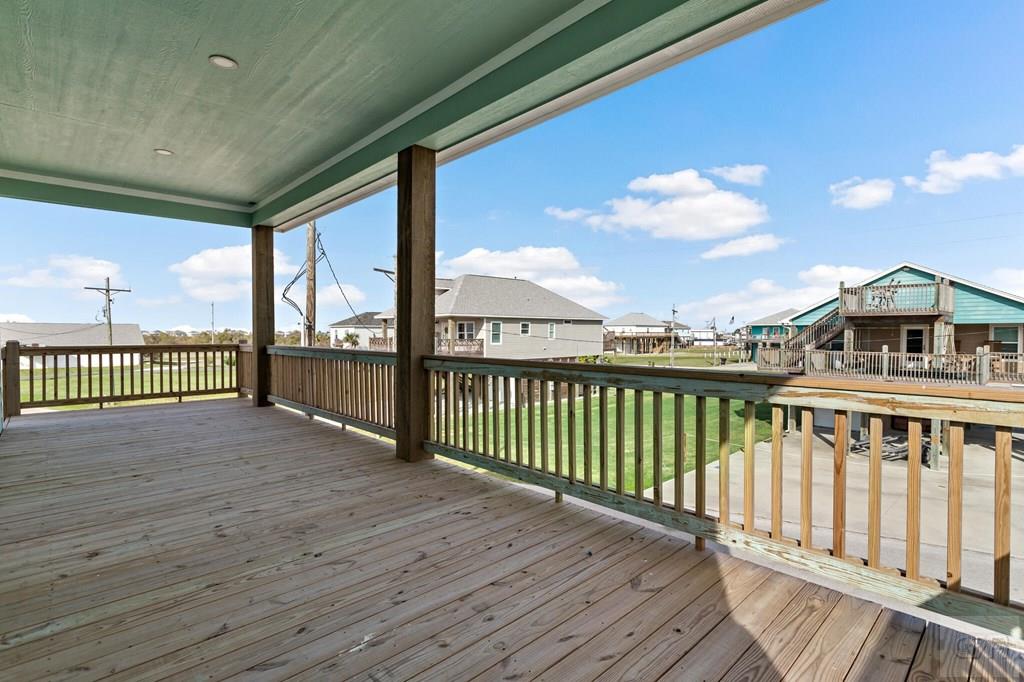 971 Tidelands Crystal Beach, TX 77650 - Photo 13 of 38 a view of a balcony with wooden floor