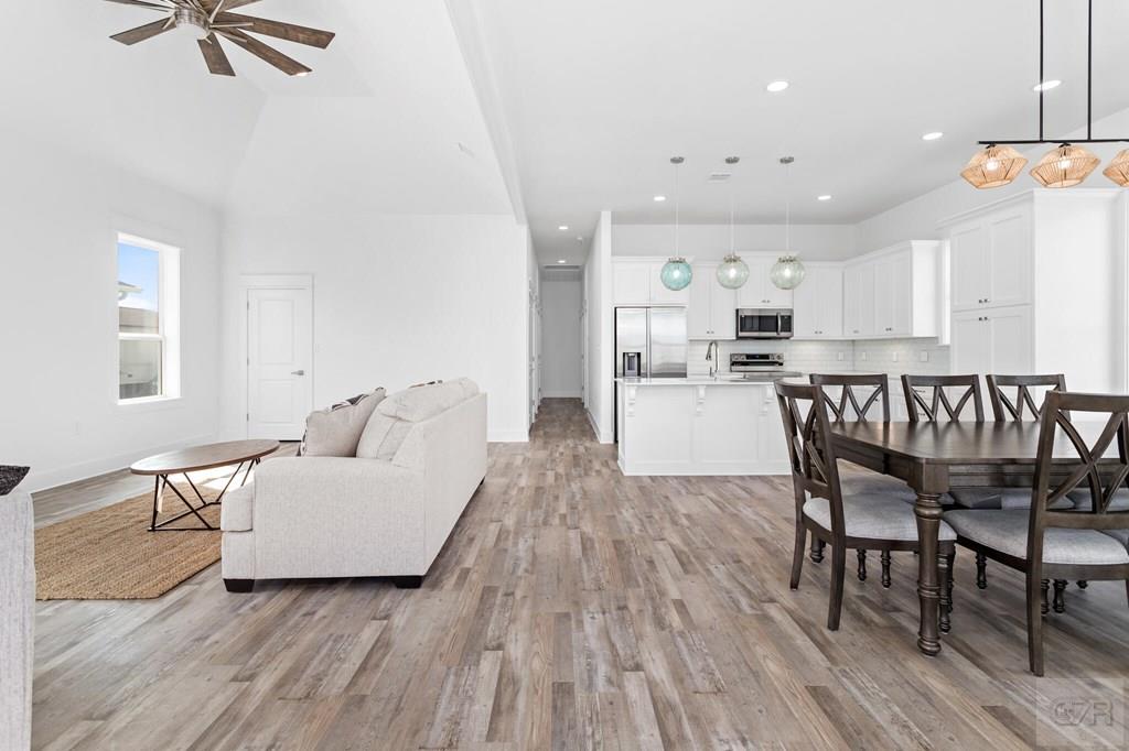 971 Tidelands Crystal Beach, TX 77650 - Photo 17 of 38 a living room with furniture and a wooden floor