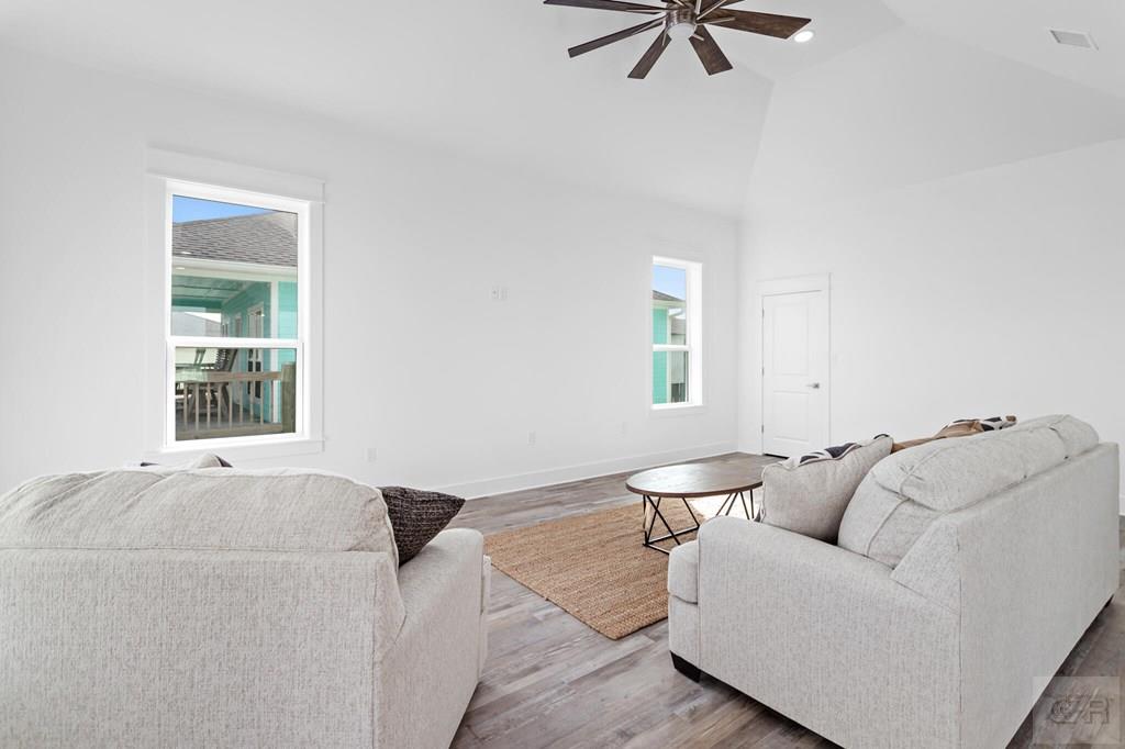 971 Tidelands Crystal Beach, TX 77650 - Photo 18 of 38 a living room with furniture and a window