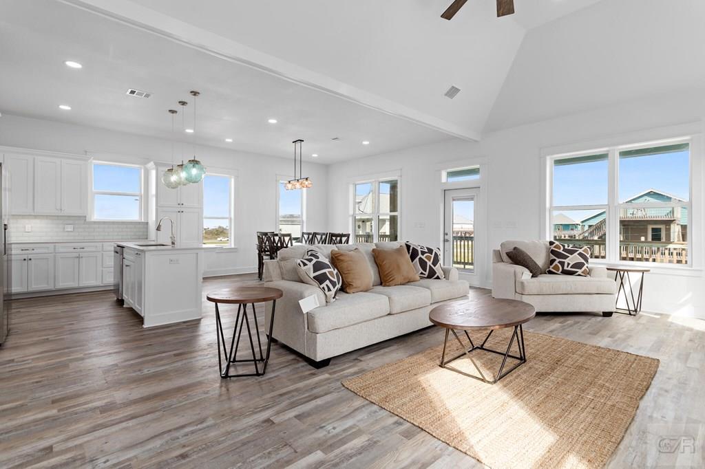 971 Tidelands Crystal Beach, TX 77650 - Photo 20 of 38 a living room with furniture and view of kitchen