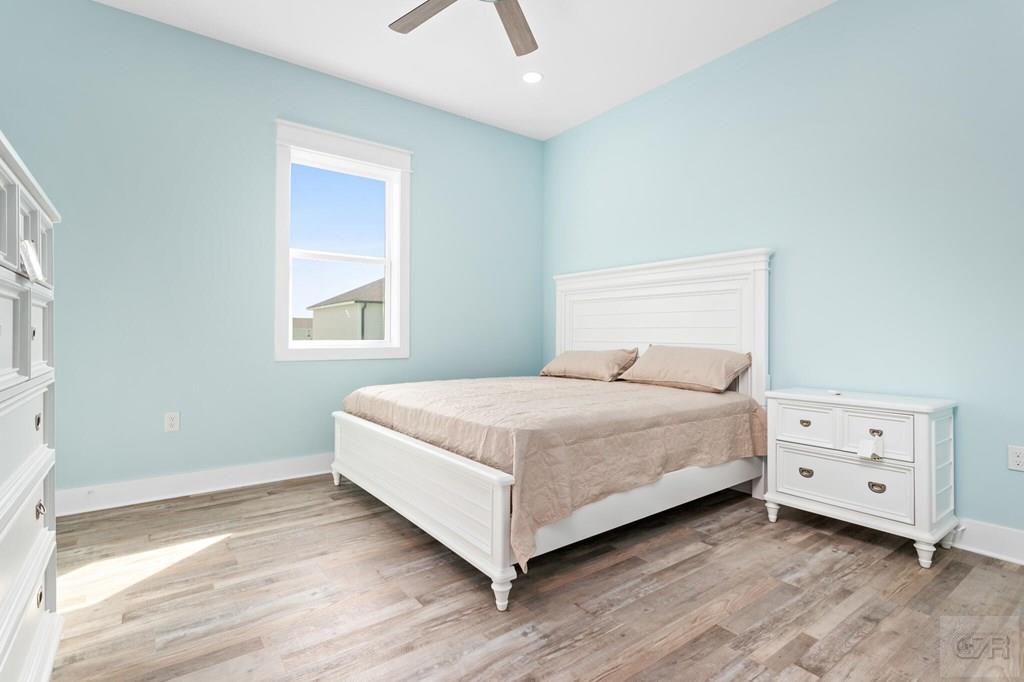 971 Tidelands Crystal Beach, TX 77650 - Photo 27 of 38 a bedroom with a bed and a window
