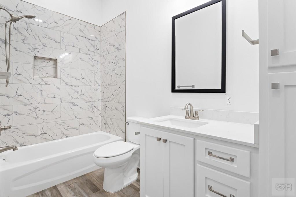 971 Tidelands Crystal Beach, TX 77650 - Photo 32 of 38 a bathroom with a sink a toilet and shower