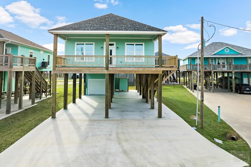 971 Tidelands Crystal Beach, TX 77650 - Photo 5 of 38 a view of a house with a yard balcony