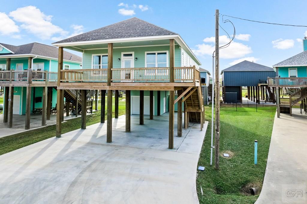 971 Tidelands Crystal Beach, TX 77650 - Photo 6 of 38 a view of a house with a yard