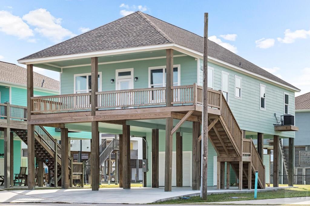 971 Tidelands Crystal Beach, TX 77650 - Photo 7 of 38 a view of a white building among the street