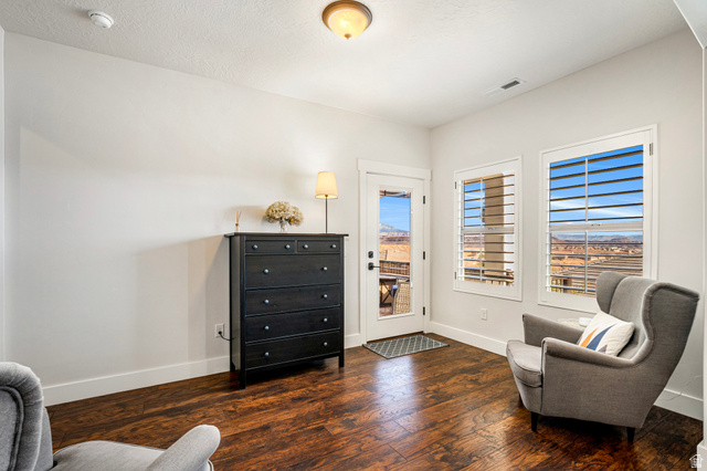 2311 South 1340 West St. George, UT 84770 - Photo 29 of 56 Living area featuring hardwood / wood-style flooring and baseboards