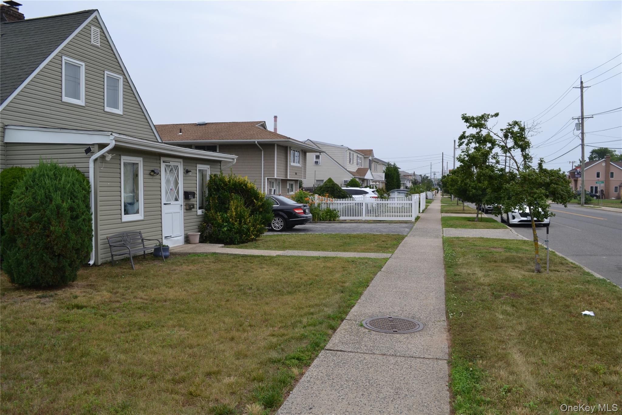 516 Long Beach Road Island Park, NY 11558 - Photo 4 of 31 Sidewalk view front of house