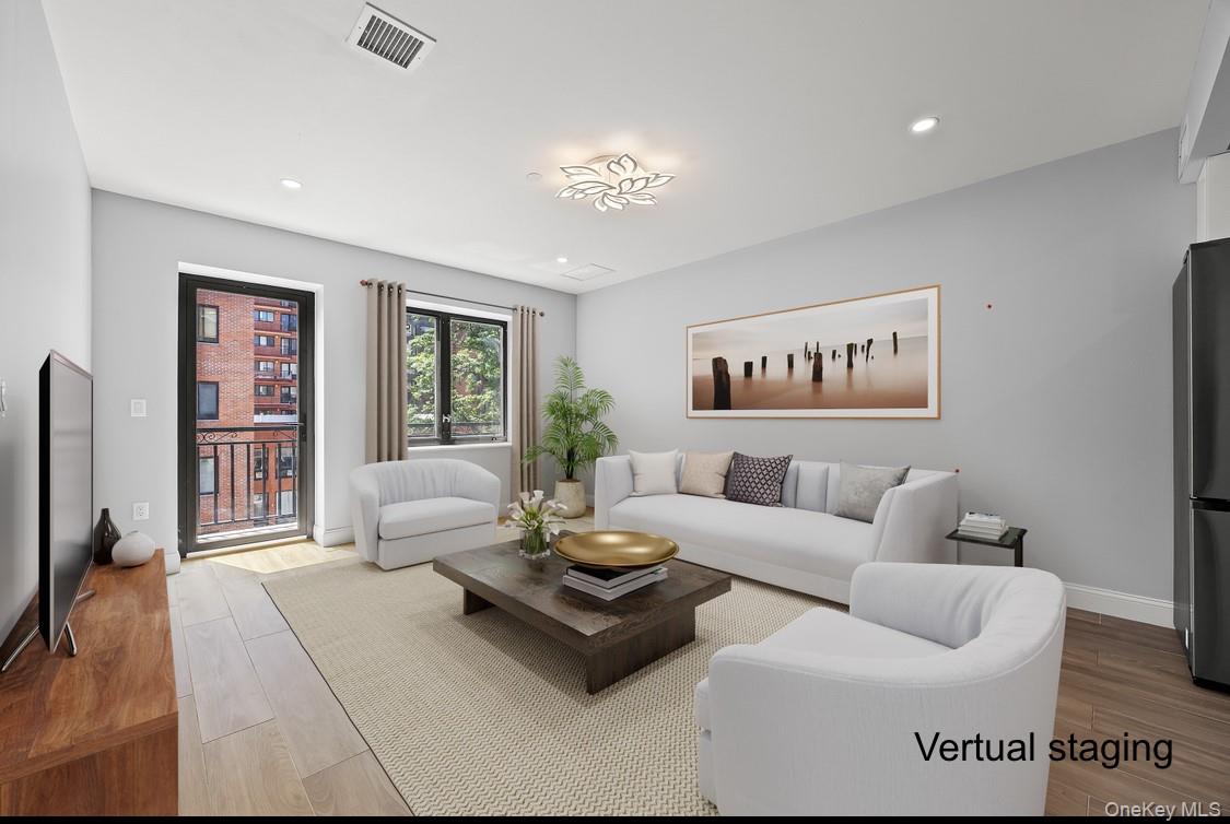 132-25 41st Avenue, Unit 3A Queens, NY 11355 - Photo 3 of 12 a living room with furniture and a large window