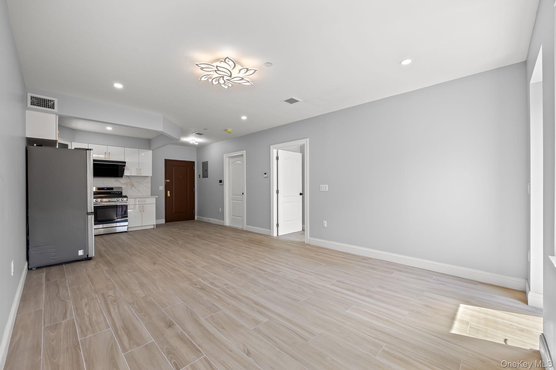 132-25 41st Avenue, Unit 3A Queens, NY 11355 - Photo 5 of 12 a view of a livingroom with a furniture