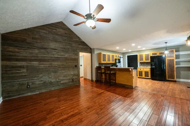 a view of kitchen with furniture and wooden floor