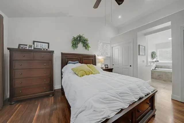 a bedroom with a bed and a dresser