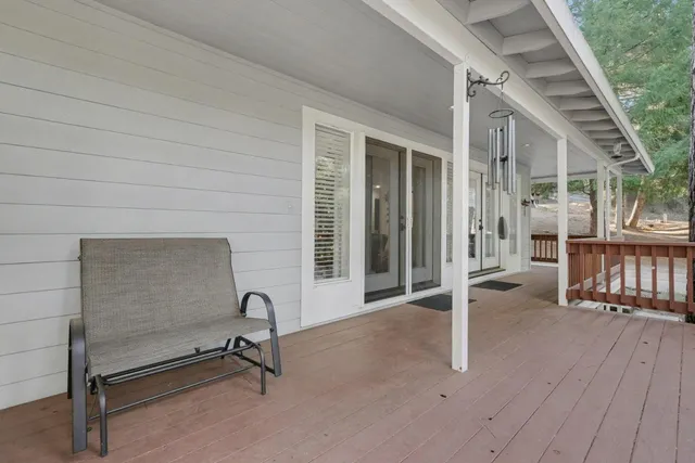 a view of a house with porch and wooden floor