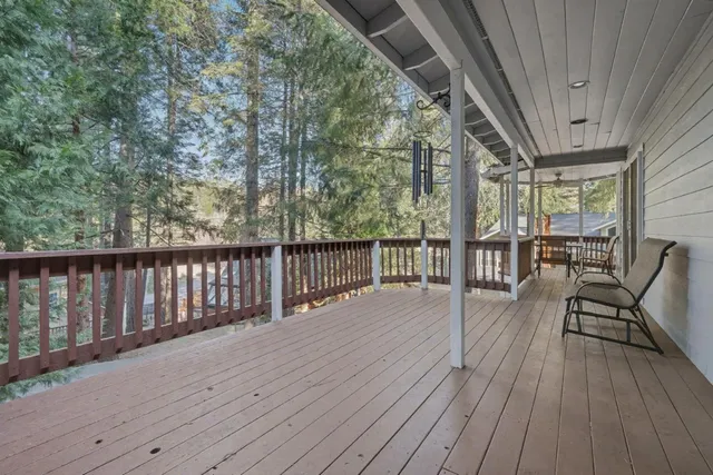 a view of balcony with wooden floor