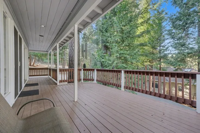 a view of balcony with wooden floor