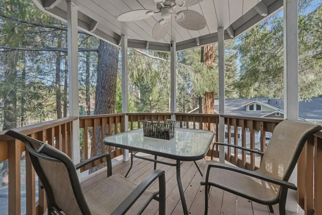 a view of a balcony with table and chairs